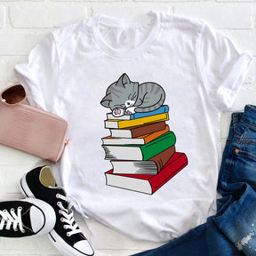 T-shirt Chat dort sur un livre