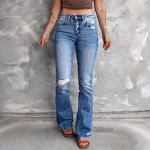 Ausgestellte Distressed-Jeans mit Taschen