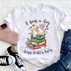 T-shirt Un livre par jour éloigne la réalité