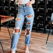 Zerrissene Vintage-Jeans mit hoher Taille und Knöpfen