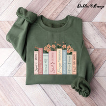 Sweat-shirt à col rond avec livres floraux